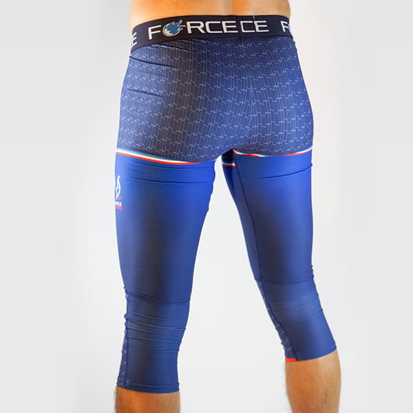 rear view of man legs wearing blue tights with force belt